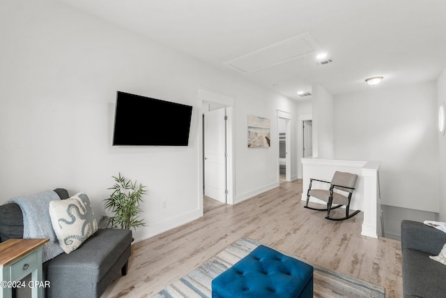 living room with light hardwood / wood-style floors