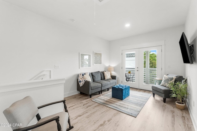 living room featuring light hardwood / wood-style floors and french doors