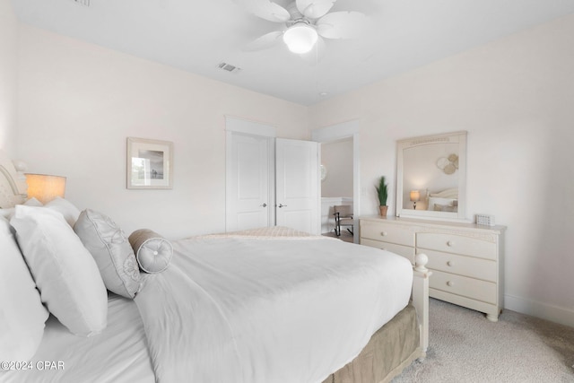 carpeted bedroom with a closet and ceiling fan