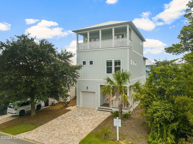 coastal home featuring a garage