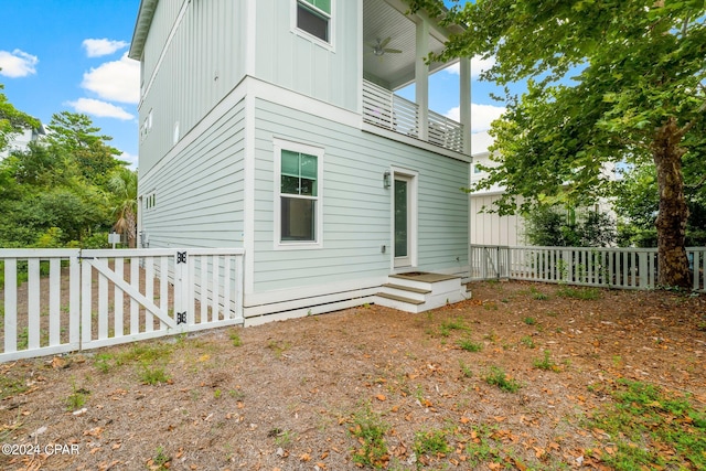 back of property with a balcony