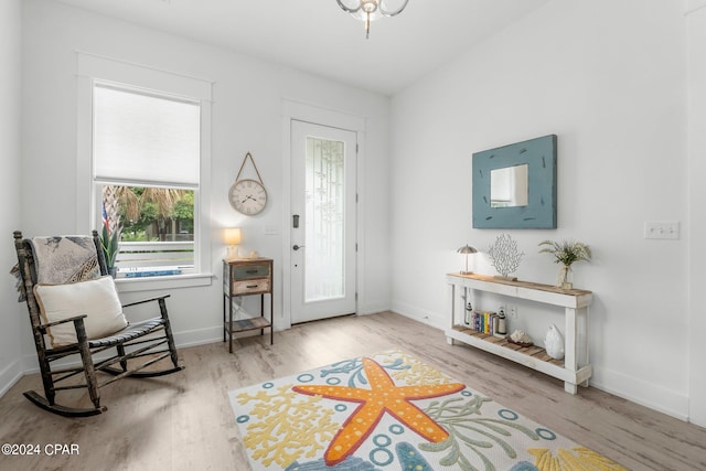 living area with a healthy amount of sunlight and light wood-type flooring