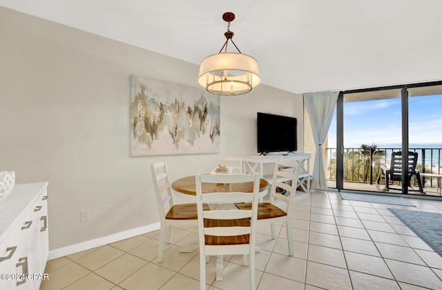 tiled dining area with expansive windows