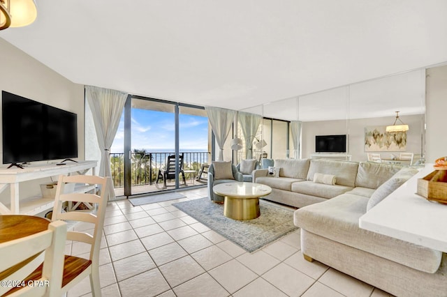 tiled living room featuring floor to ceiling windows