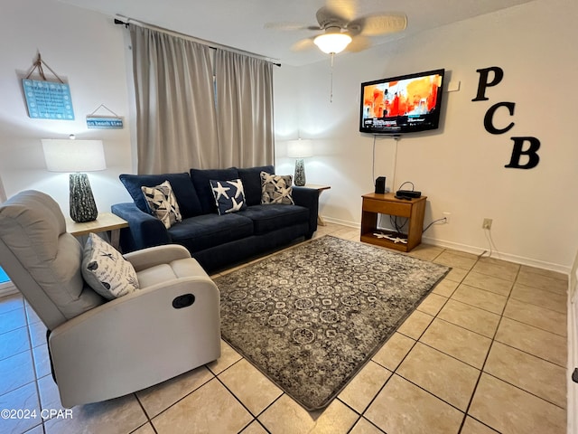 living room featuring ceiling fan and light tile patterned floors