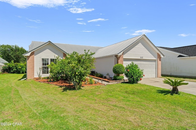 single story home with a garage and a front lawn