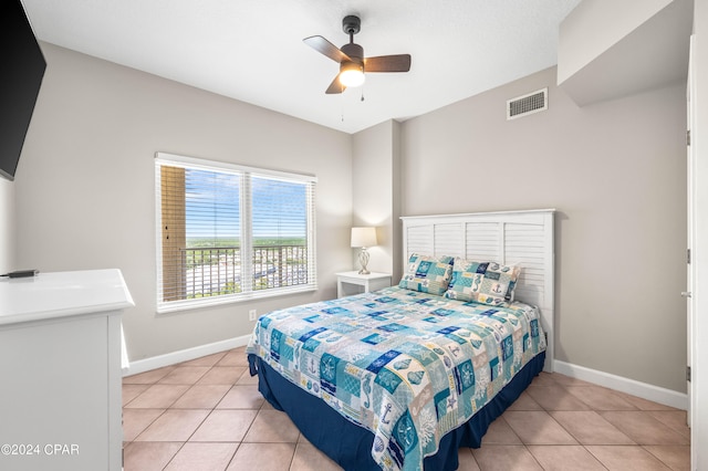 bedroom with light tile patterned floors and ceiling fan