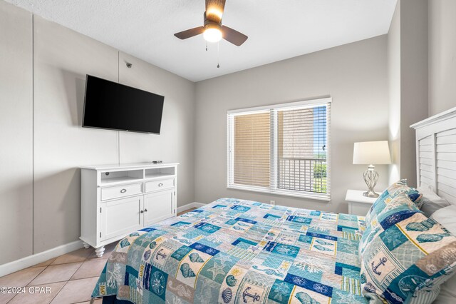 bedroom featuring light tile patterned floors and ceiling fan