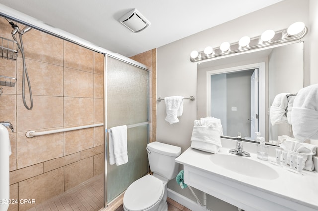 bathroom featuring sink, toilet, and walk in shower