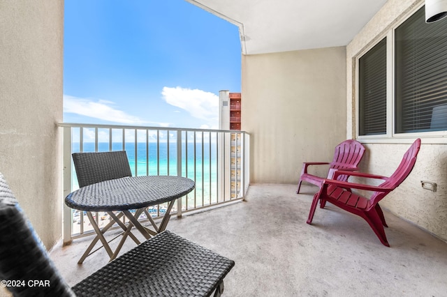 balcony featuring a water view