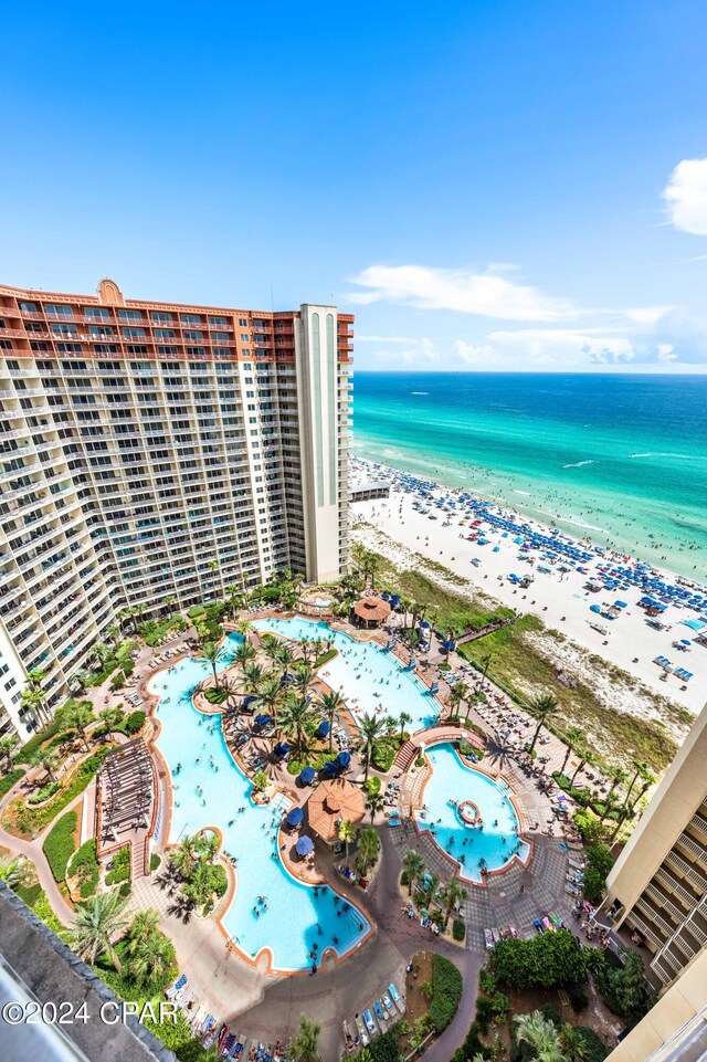 bird's eye view featuring a view of the beach and a water view