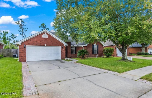 ranch-style home with brick siding, concrete driveway, a front yard, and fence