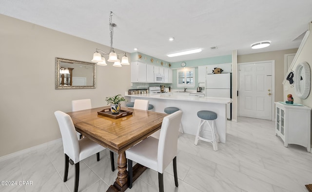 dining area featuring sink