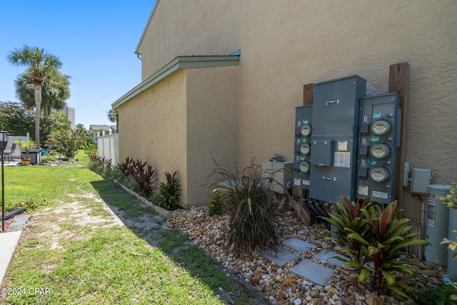 view of property exterior with a yard