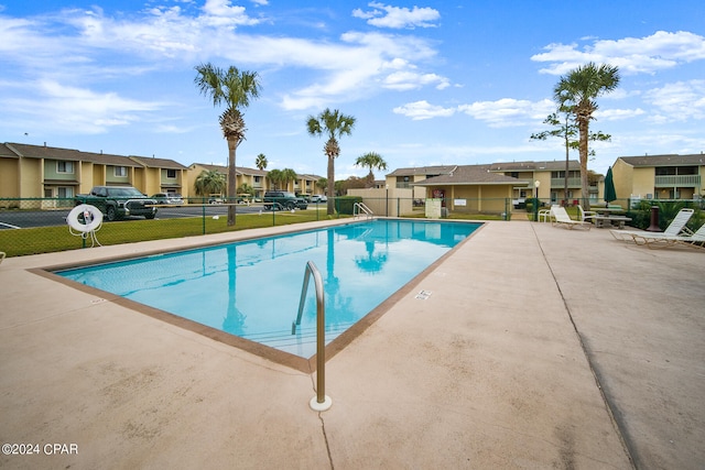 view of swimming pool with a patio area