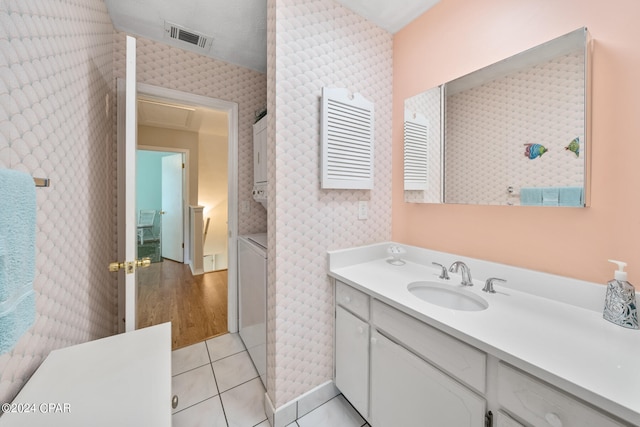 bathroom with vanity and tile patterned flooring