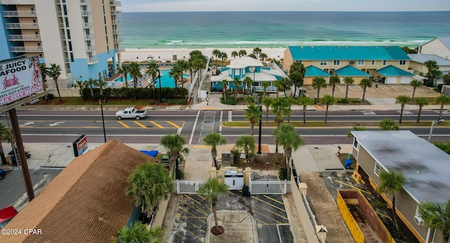 drone / aerial view featuring a view of the beach and a water view