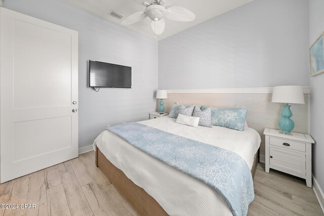 bedroom featuring ceiling fan and light hardwood / wood-style floors