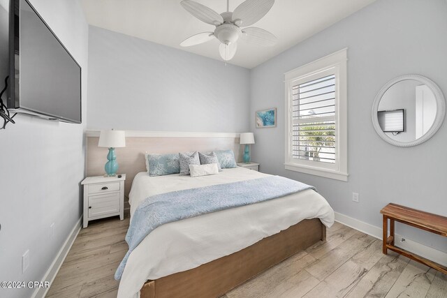 93 Emerald Cove Ln, Inlet Beach, FL 32461 - bedroom featuring baseboards, a ceiling fan, and light wood-style flooring
