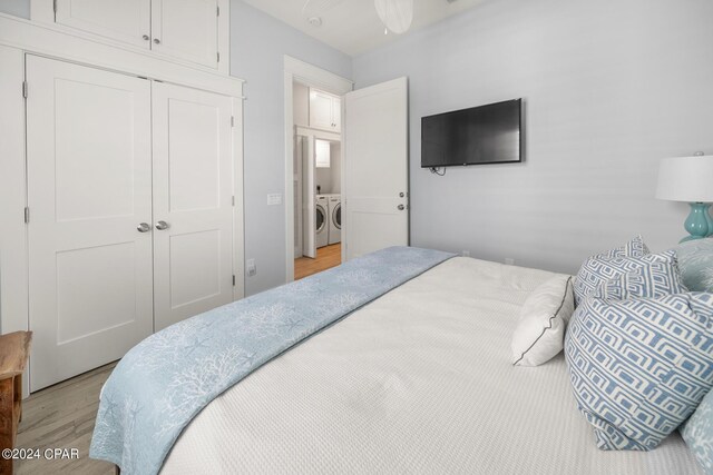 bedroom with light hardwood / wood-style flooring and ceiling fan