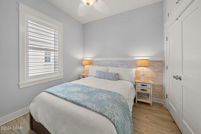 93 Emerald Cove Ln, Inlet Beach, FL 32461 - bedroom with light wood finished floors, a ceiling fan, and baseboards