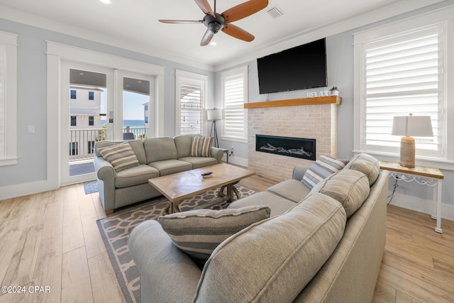 93 Emerald Cove Ln, Inlet Beach, FL 32461 - living area featuring ceiling fan, a wealth of natural light, a brick fireplace, and wood-type flooring