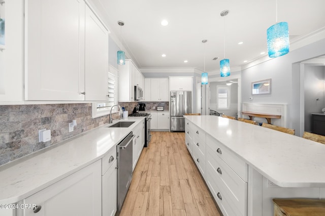 93 Emerald Cove Ln, Inlet Beach, FL 32461 - kitchen featuring light wood finished floors, a breakfast bar, a sink, and appliances with stainless steel finishes
