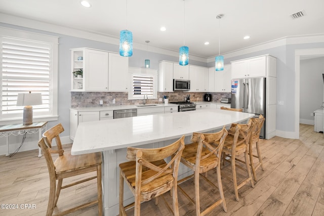 93 Emerald Cove Ln, Inlet Beach, FL 32461 - kitchen with white cabinets, visible vents, appliances with stainless steel finishes, and a sink