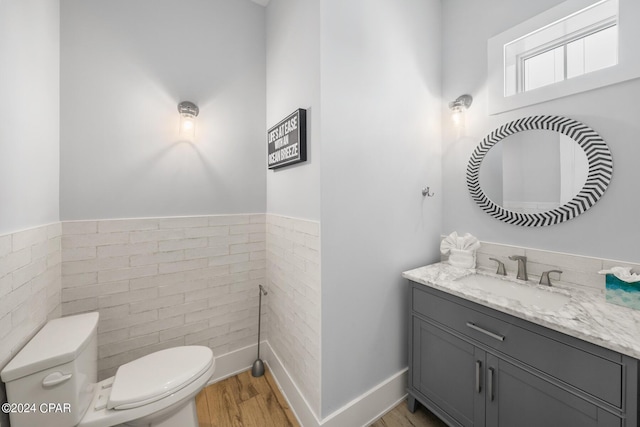 93 Emerald Cove Ln, Inlet Beach, FL 32461 - half bath featuring baseboards, wood finished floors, vanity, and toilet