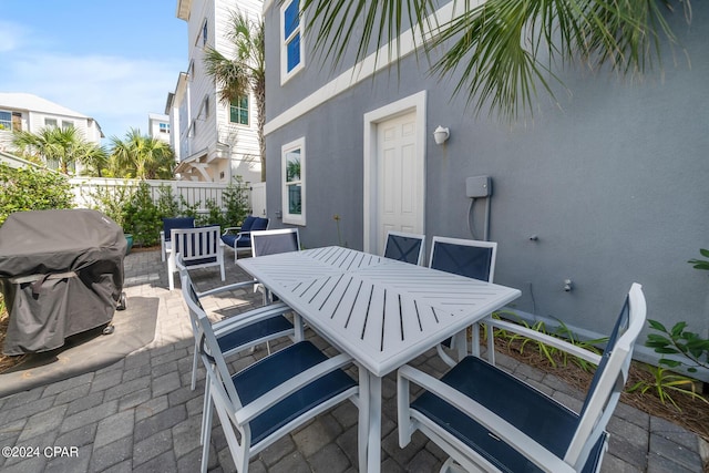 93 Emerald Cove Ln, Inlet Beach, FL 32461 - view of patio / terrace featuring outdoor dining area, fence, and area for grilling