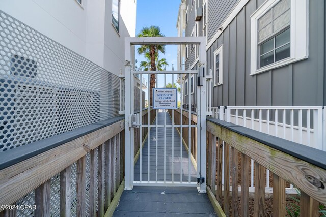 view of side of property featuring a balcony and french doors