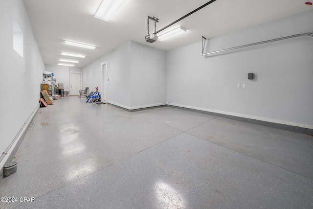 93 Emerald Cove Ln, Inlet Beach, FL 32461 - garage with baseboards and a garage door opener