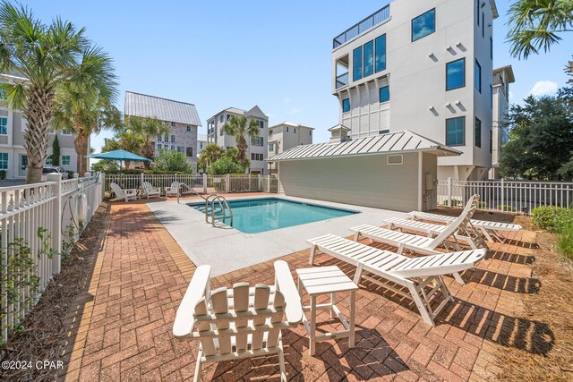 view of swimming pool featuring a patio