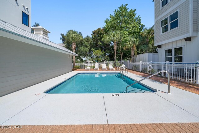 view of pool featuring a patio