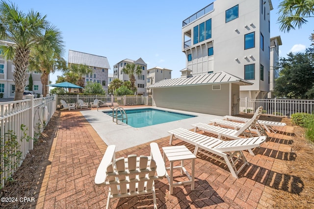 93 Emerald Cove Ln, Inlet Beach, FL 32461 - pool featuring fence, a patio area, and a residential view