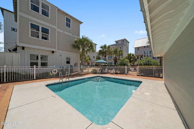 93 Emerald Cove Ln, Inlet Beach, FL 32461 - community pool featuring fence and a patio