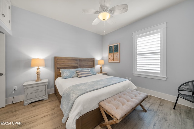 bedroom featuring light hardwood / wood-style flooring and ceiling fan