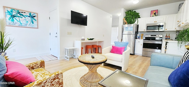 living room with light hardwood / wood-style flooring