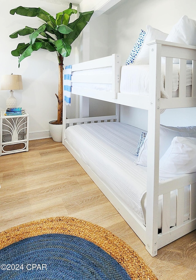 unfurnished bedroom featuring wood-type flooring