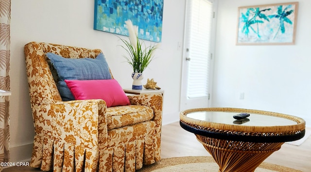 sitting room featuring hardwood / wood-style floors