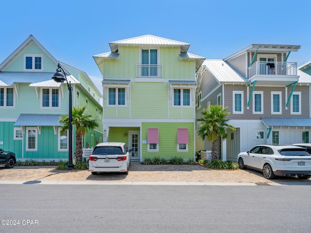 view of front of property with a standing seam roof, metal roof, and board and batten siding