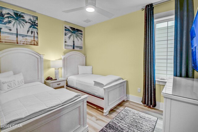 bedroom with ceiling fan and light hardwood / wood-style floors