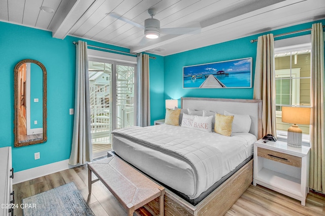 bedroom with beamed ceiling, ceiling fan, access to outside, and light hardwood / wood-style floors