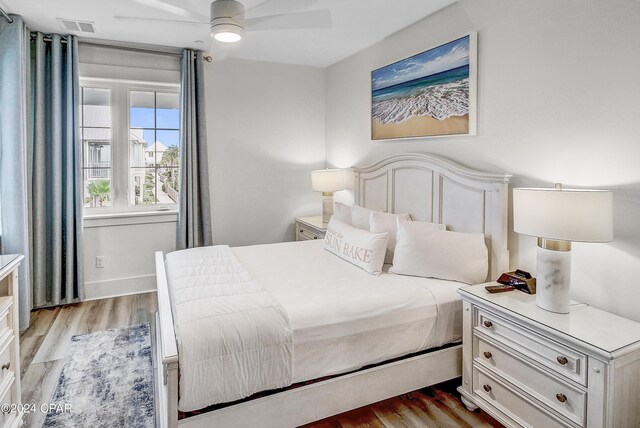 bedroom featuring light hardwood / wood-style flooring and ceiling fan