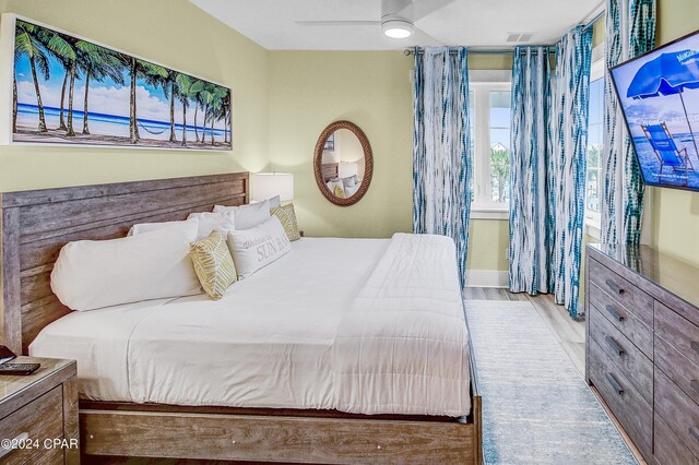 bedroom featuring ceiling fan and light hardwood / wood-style flooring