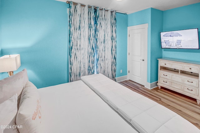 bedroom with light wood-type flooring