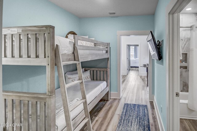 bedroom featuring light wood-type flooring