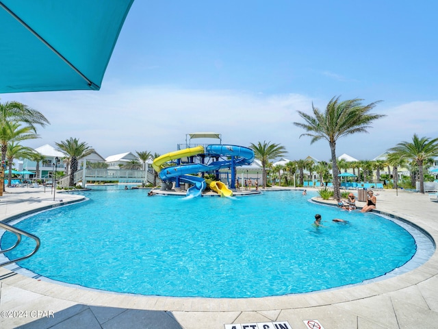 view of swimming pool featuring a water slide