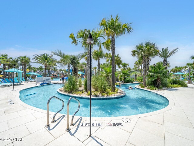 view of swimming pool with a patio area