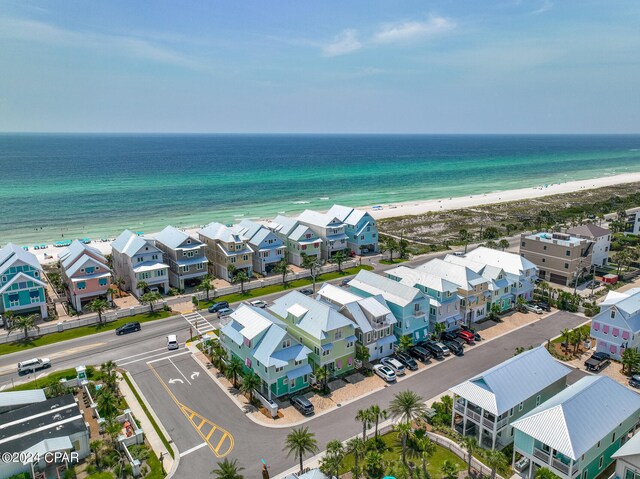 bird's eye view featuring a water view and a view of the beach